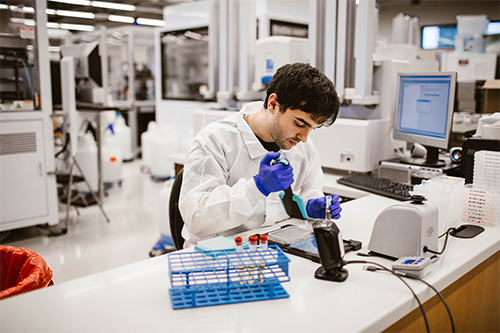 Lab Tech working on test tubes with immunoassay  